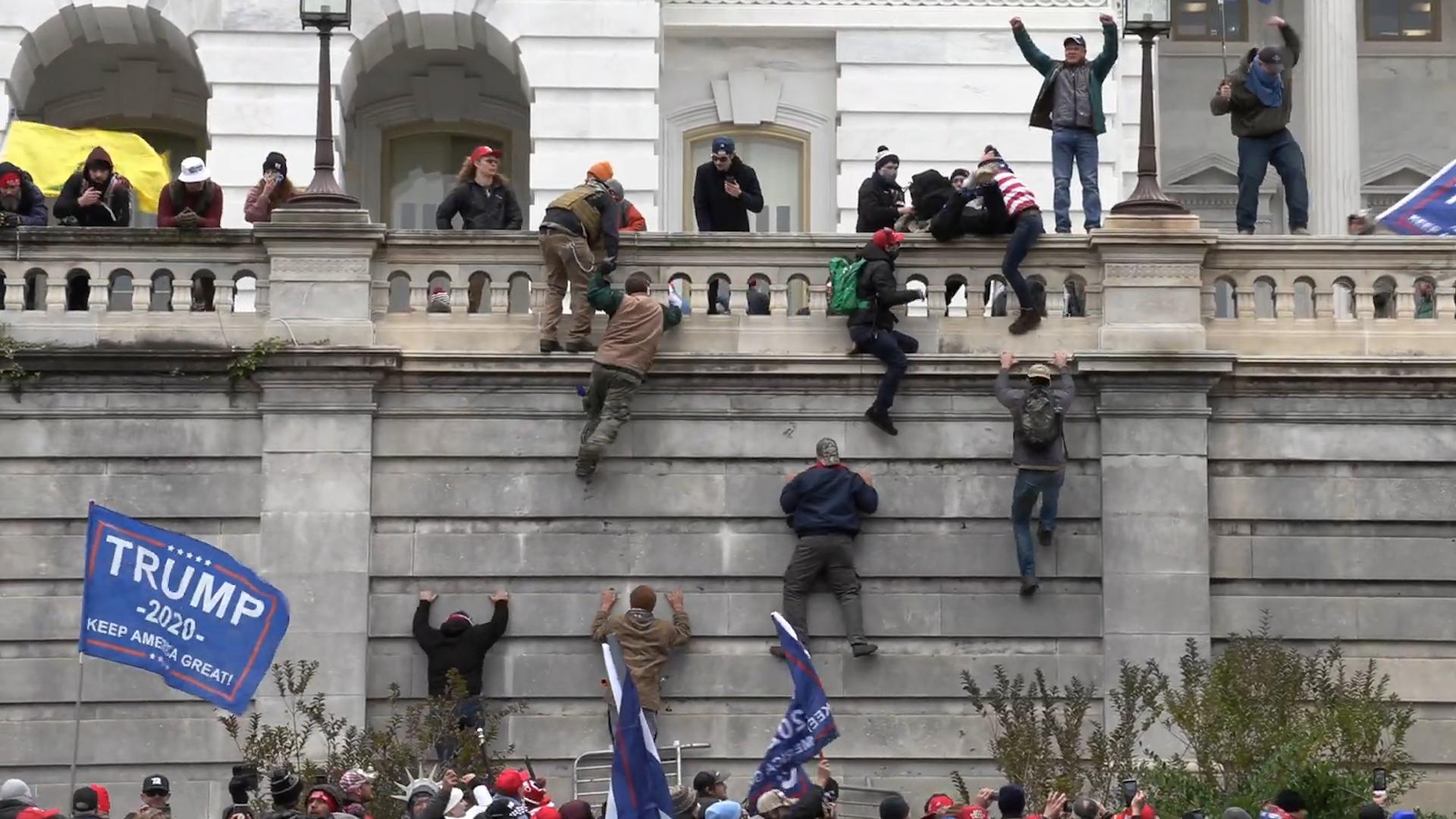 Day of Rage: How Trump Supporters Took the U.S. Capitol Background