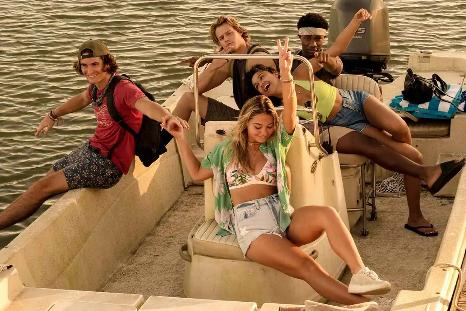 Outer Banks characters chilling on a boat